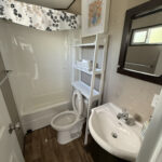 Updated bathroom in Mildred's 3-bedroom resort cottage at Bellmere Winds