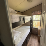 Left bunkroom with two twin beds at Mildred's Lakefront Resort Cottage, Bellmere Winds Golf Resort, Kawarthas