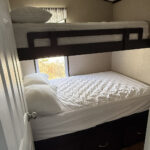 Bunkroom with one twin and one double bed at Mildred's 3-bedroom cottage, Bellmere Winds Golf Resort, Kawarthas