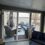Front deck with Muskoka chairs overlooking Rice Lake at Mildred's Lakefront Resort Cottage, Bellmere Winds