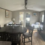 Open-concept dining and living room at Mildred's Lakefront Resort Cottage on Rice Lake